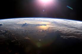 Sun above Planet Earth.